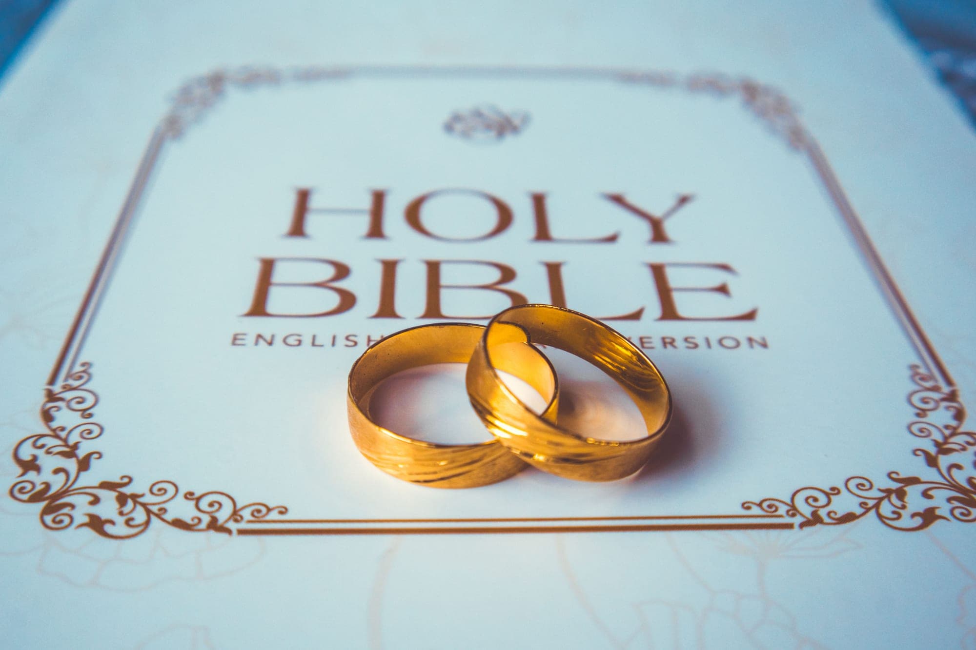 Wedding rings resting on the Bible